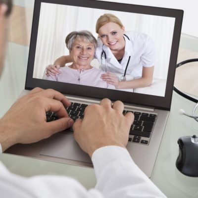 Doctor Video Chatting With Nurse And Patient