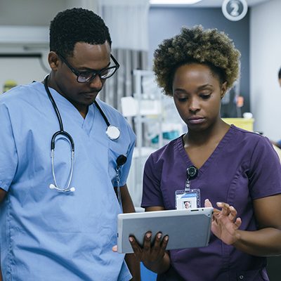 Nurse is using digital tablet in hospital